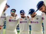 India's captain Rohit Sharma with Virat Kohli, Suryakumar Yadav, and other players in a huddle