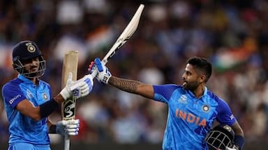 Suryakumar Yadav and Axar Patel leave the field after India's innings against Zimbabwe during the ICC T20 World Cup 2022