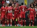 Luis Diaz (C) celebrates with teammates after scoring his team's first goal during the English Premier League football match between Liverpool and Bournemouth