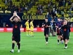 Barcelona's Polish forward #09 Robert Lewandowski celebrates at the end of the Spanish league football match between Villarreal CF and FC Barcelona at La Ceramica stadium in Vila-real, on September 22