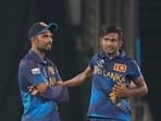 Sri Lanka's captain Dasun Shanaka, left, speaks to Matheesha Pathirana during the ICC Cricket World Cup match between Pakistan and Sri Lanka in Hyderabad