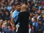 Manchester City's Rodri with manager Pep Guardiola.