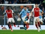 Manchester City's Phil Foden in action with Arsenal's Declan Rice.