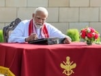 Modi inscribes his thoughts in Visitors' Book at the National War Memorial in New Delhi.(BJP Media)