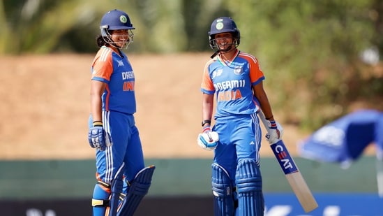 India Women's captain Harmanpreet Kaur and teammate Richa Ghosh celebrate their partnership during the Group A match against United Arab Emirates Women