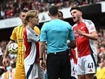 Arsenal's Declan Rice reacts after being shown a second yellow card before being shown a red card.