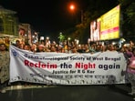 People hold banners during a candlelight march. Reclaim the night march seemed to have returned to the streets of Kolkata for the second time.(PTI)